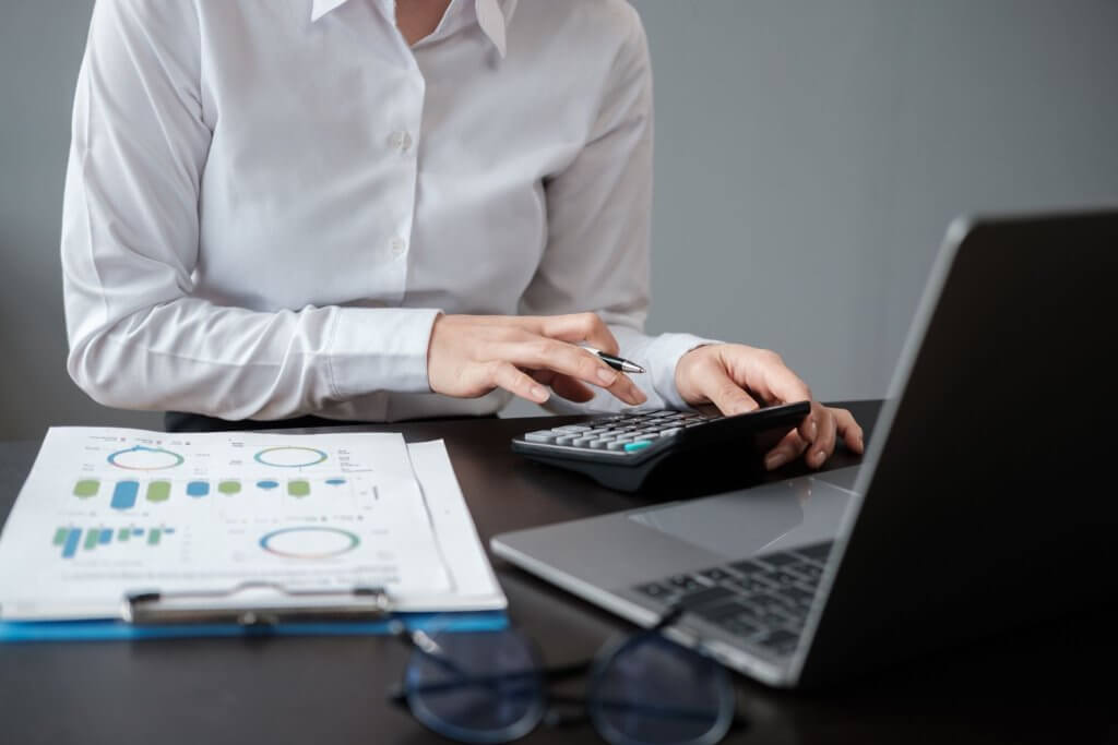 an accountant calculating using his calculator