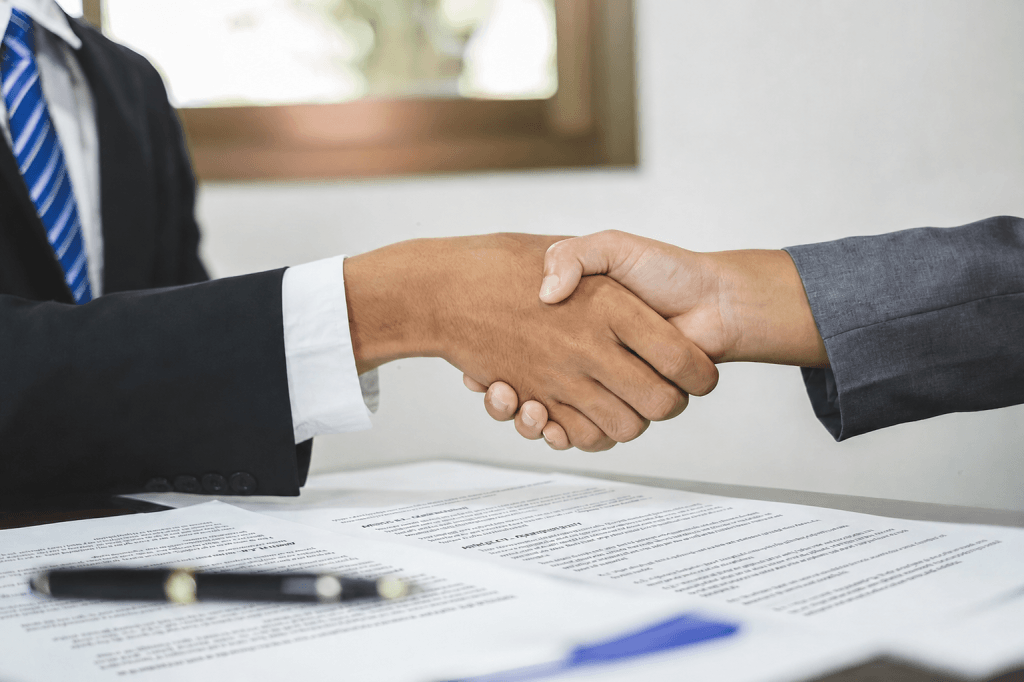 Two people shaking hands.